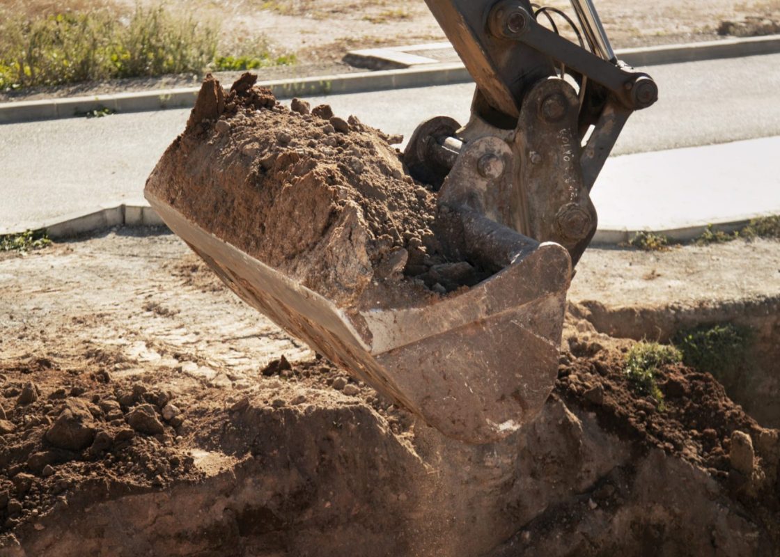 heavy-excavator-digging-day-light-outdoors heavy-excavator-digging-day-light-outdoors